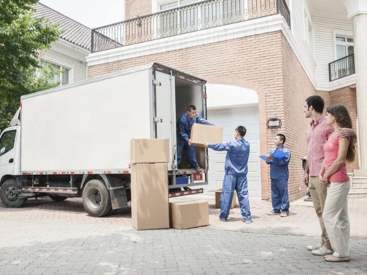 movers transporting furniture up a staircase in Belmar
